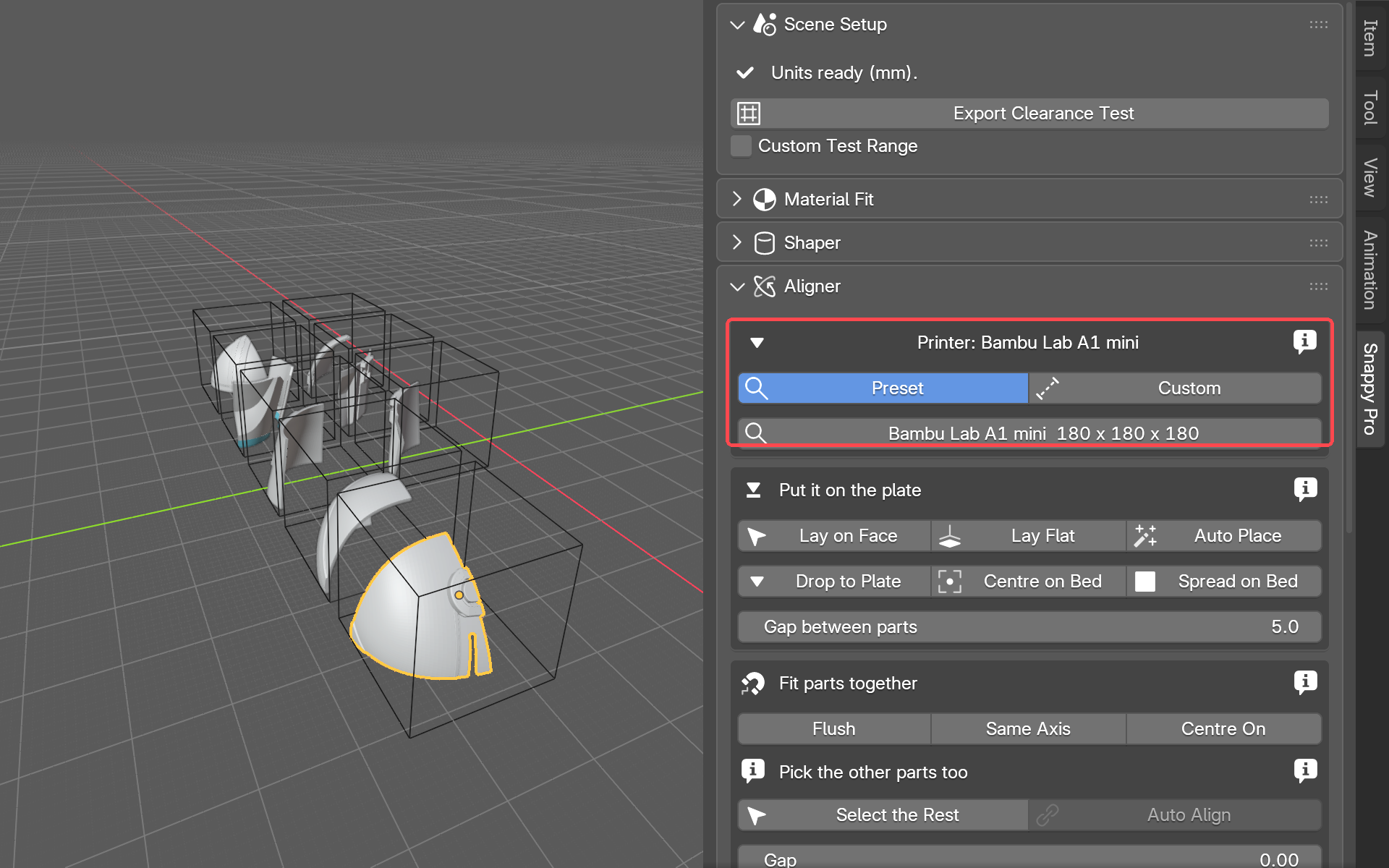The split helmet parts framed together in the viewport, one selected, with the Aligner panel open