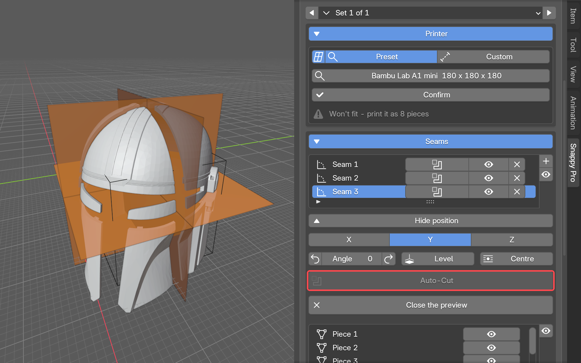 The helmet after Auto-Cut, with seam planes placed through it and the panel still showing the piece count